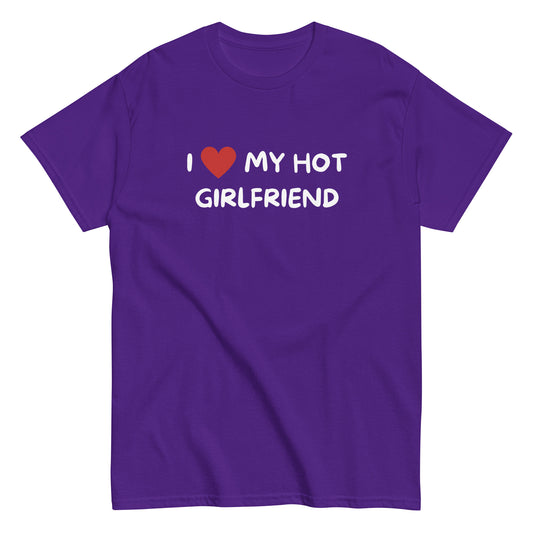 The I Love My Hot Girlfriend T-Shirt by FunnyDripStore features bold white lettering and a red heart on a purple shirt—a fun, standout choice for anyone who loves quirky and eye-catching clothing.
