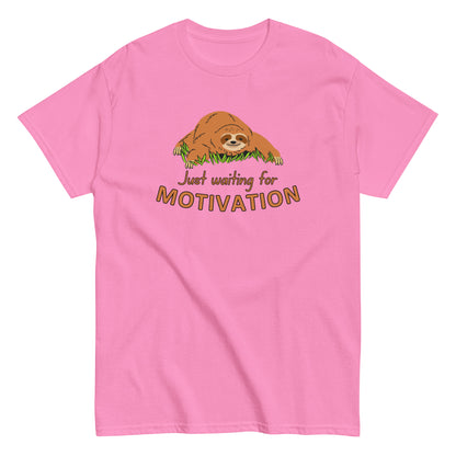 The Just Waiting For Motivation T-Shirt by FunnyDripStore features a smiling sloth on grass above bold orange and yellow text—a perfect choice for fans of funny apparel.