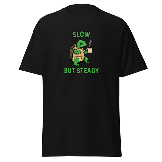 The FunnyDripStore Slow But Steady T-Shirt is a black tee with a cartoon turtle holding a coffee mug and SLOW above and BUT STEADY below in green—perfect meme shirt for coffee lovers.