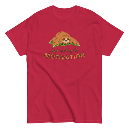 The Just Waiting For Motivation T-Shirt by FunnyDripStore features a smiling sloth on grass above bold orange and yellow text—a perfect choice for fans of funny apparel.