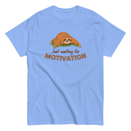 The Just Waiting For Motivation T-Shirt by FunnyDripStore features a smiling sloth on grass above bold orange and yellow text—a perfect choice for fans of funny apparel.