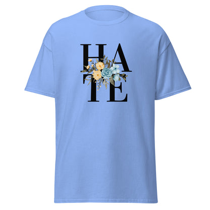 The Hate T-Shirt by FunnyDripStore features HATE in bold black text on white, overlaid with yellow and blue flowers plus green leaves—a unique, funny shirt designed to spark conversation.
