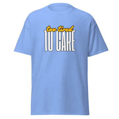 The FunnyDripStore Too Tired To Care T-Shirt in charcoal features too tired in yellow cursive above bold white TO CARE, making this meme shirt funny and ideal for relaxed days.