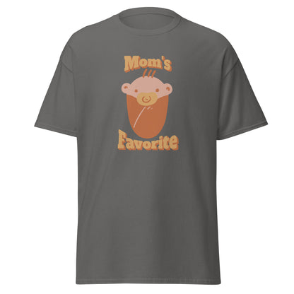 FunnyDripStore’s Moms Favorite T-Shirt in black features a cartoon baby face with a pacifier and “Moms Favorite” text in light brown—a playful, funny tee perfect for anyone who loves to show off their sense of humor!.
