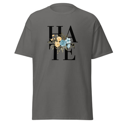 The Hate T-Shirt by FunnyDripStore features HATE in bold black text on white, overlaid with yellow and blue flowers plus green leaves—a unique, funny shirt designed to spark conversation.