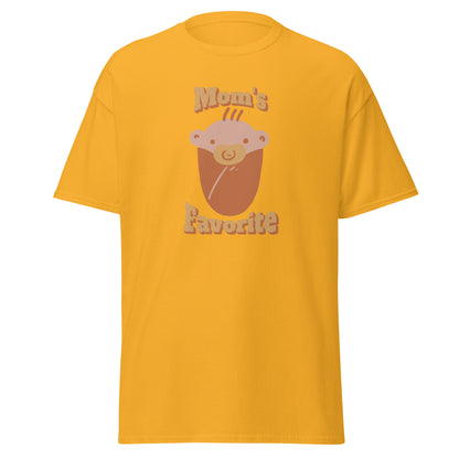 FunnyDripStore’s Moms Favorite T-Shirt in black features a cartoon baby face with a pacifier and “Moms Favorite” text in light brown—a playful, funny tee perfect for anyone who loves to show off their sense of humor!.