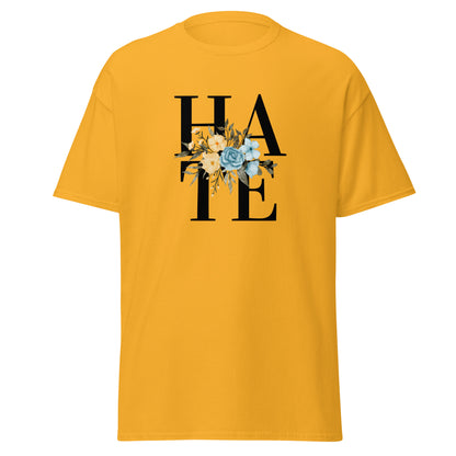 The Hate T-Shirt by FunnyDripStore features HATE in bold black text on white, overlaid with yellow and blue flowers plus green leaves—a unique, funny shirt designed to spark conversation.