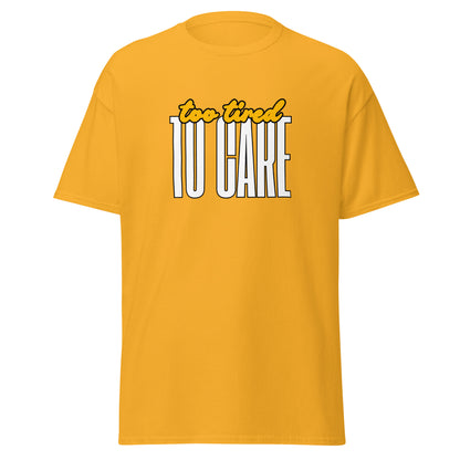 The FunnyDripStore Too Tired To Care T-Shirt in charcoal features too tired in yellow cursive above bold white TO CARE, making this meme shirt funny and ideal for relaxed days.
