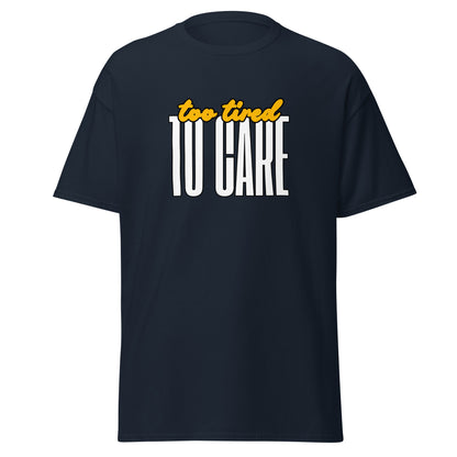 The FunnyDripStore Too Tired To Care T-Shirt in charcoal features too tired in yellow cursive above bold white TO CARE, making this meme shirt funny and ideal for relaxed days.