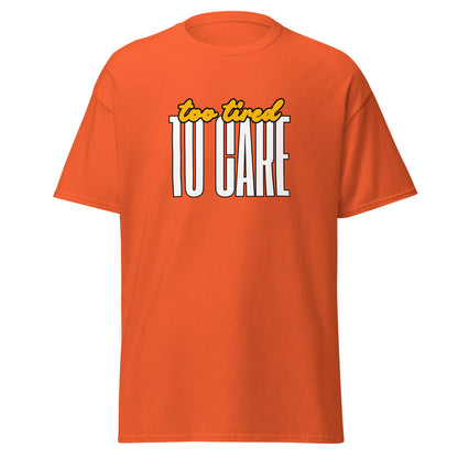 The FunnyDripStore Too Tired To Care T-Shirt in charcoal features too tired in yellow cursive above bold white TO CARE, making this meme shirt funny and ideal for relaxed days.