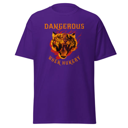 The Dangerous When Hungry T-Shirt by FunnyDripStore features a bold tiger head with flames and yellow-orange text reading DANGEROUS above and WHEN HUNGRY below—perfect for anyone who loves funny, eye-catching style.