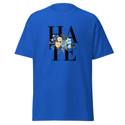 The Hate T-Shirt by FunnyDripStore features HATE in bold black text on white, overlaid with yellow and blue flowers plus green leaves—a unique, funny shirt designed to spark conversation.