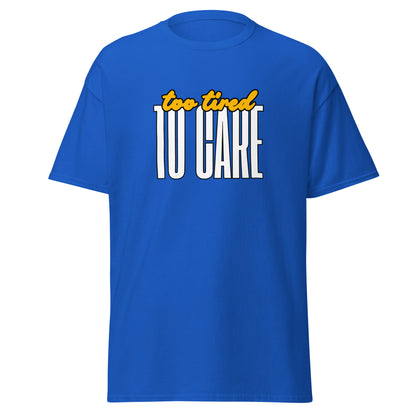 The FunnyDripStore Too Tired To Care T-Shirt in charcoal features too tired in yellow cursive above bold white TO CARE, making this meme shirt funny and ideal for relaxed days.