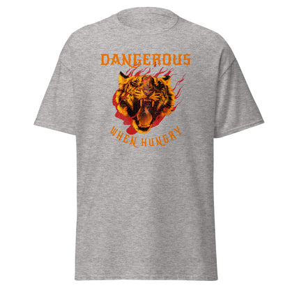 The Dangerous When Hungry T-Shirt by FunnyDripStore features a bold tiger head with flames and yellow-orange text reading DANGEROUS above and WHEN HUNGRY below—perfect for anyone who loves funny, eye-catching style.