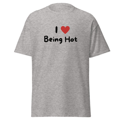 The I Love Being Hot T-Shirt by FunnyDripStore features bold I ♥ Being Hot text with a red heart, making it a playful meme shirt for those who love stylish, funny designs.