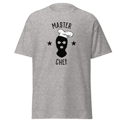 The Master Chef T-Shirt by FunnyDripStore features a black ski mask in a chef’s hat, two black stars, and bold “MASTER CHEF” text above and below the graphic.