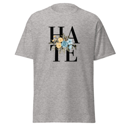 The Hate T-Shirt by FunnyDripStore features HATE in bold black text on white, overlaid with yellow and blue flowers plus green leaves—a unique, funny shirt designed to spark conversation.